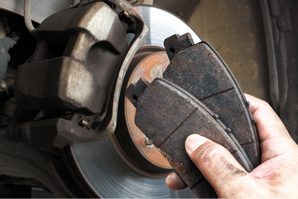 brake pad replacement, auto repair in Bend, OR at Mountain View Imports. Image of worn brake pads removed from a vehicle, emphasizing the importance of timely brake replacement for safety and smooth stopping power.